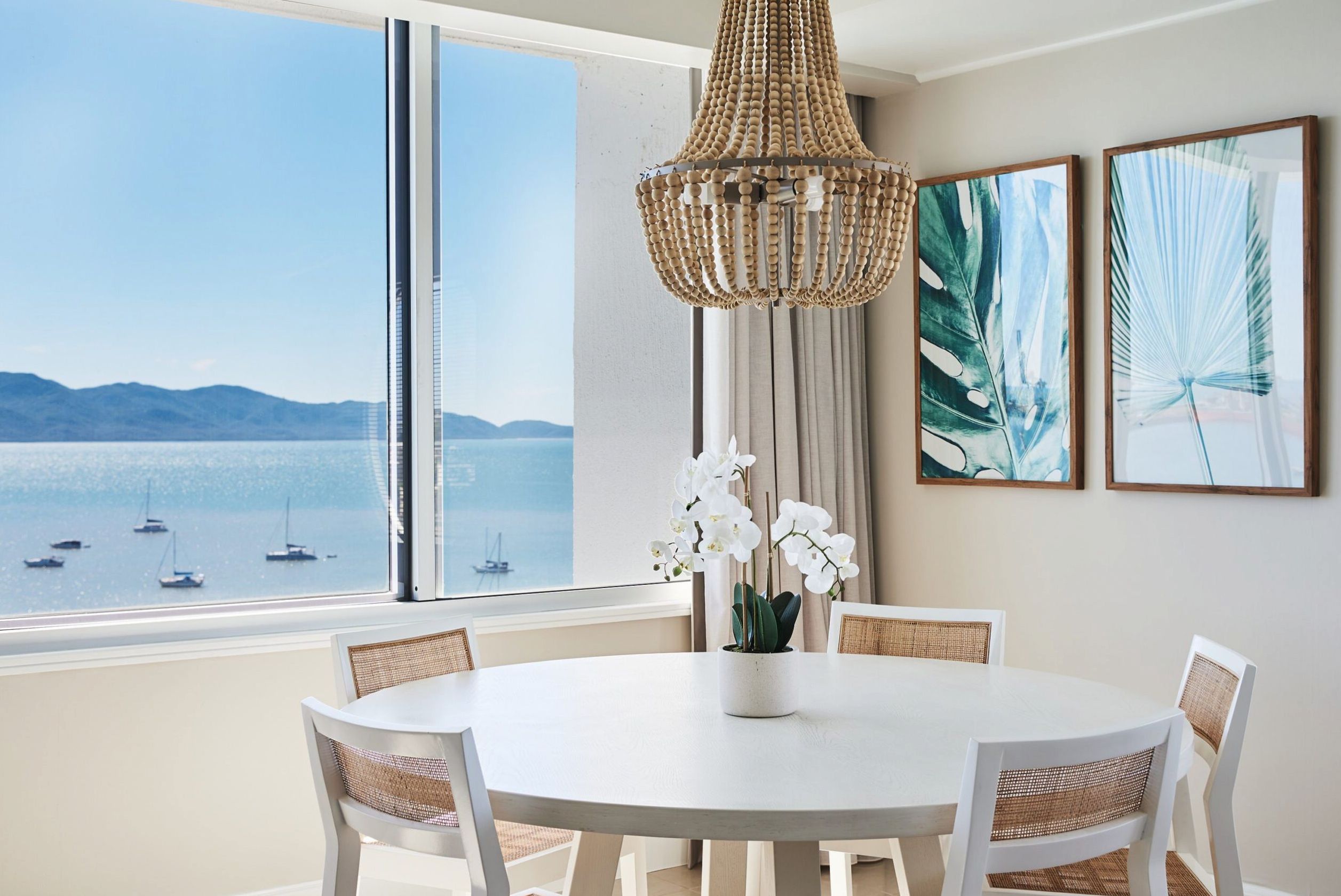 Pelorus Suite top-floor suite with ocean views, living and dining areas at The Ville